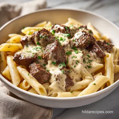 Cajun Steak Tips with Penne in Creamy Garlic Parmesan Cheese Sauce for 4 Servings Recipe Card